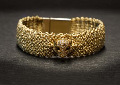 woven bracelet in gold color with leopard