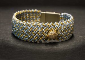 woven bracelet with turtle pendant