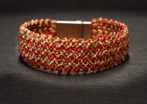 woven bracelet striped in red/gold